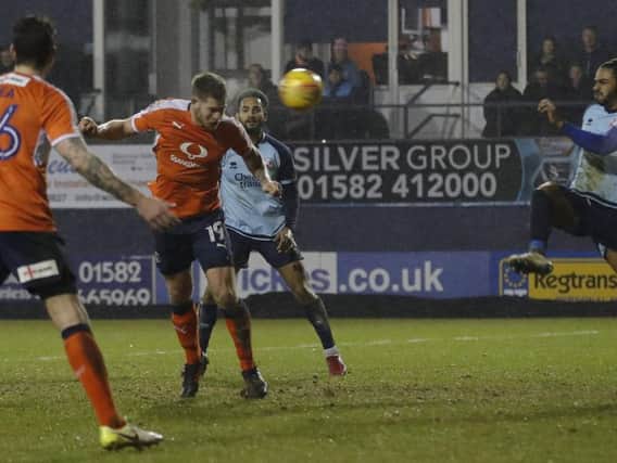 James Collins heads home the second for Luton last night