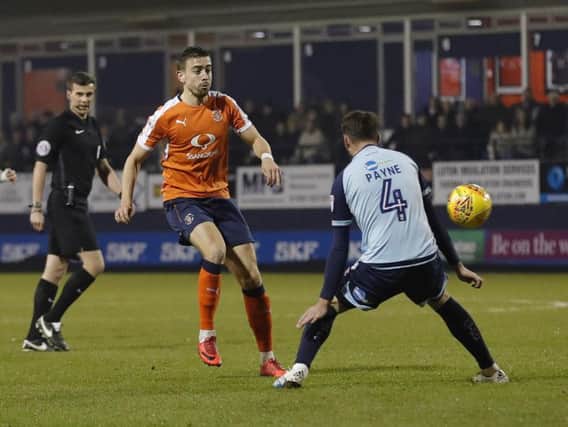 Hatters midfielder Olly Lee looks for a way through against Crawley