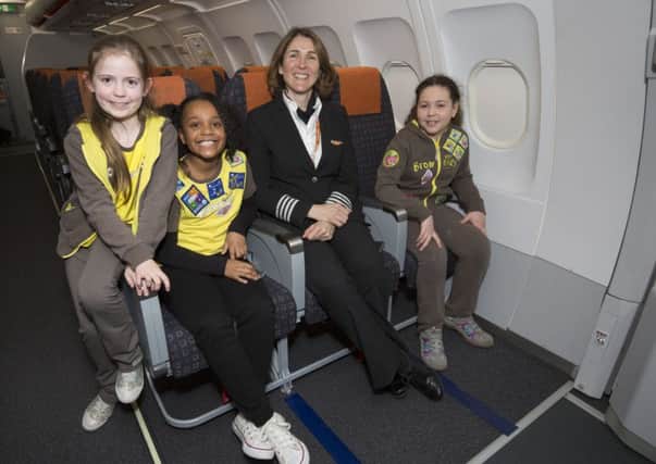 'Brownies meet easyJet Captains Marnie and Kate at Luton Airport to learn more about a pilot's job and launch the easyJet-sponsored Aviation Badge for Brownies.'