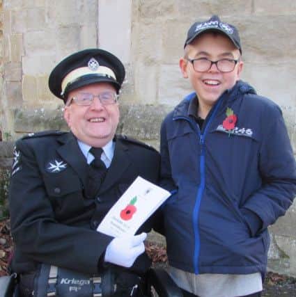 Clem with his dad, Mike Garrand on Remembrance Sunday after the parade in Dunstable.