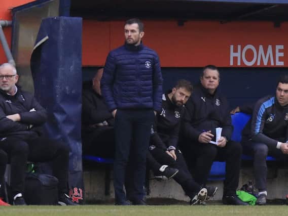 Hatters boss Nathan Jones watches on against Accrington