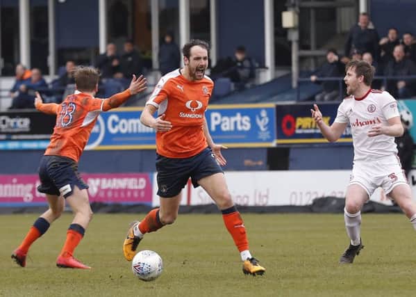 Danny Hylton can't hide his frustration as this attack was halted for a foul