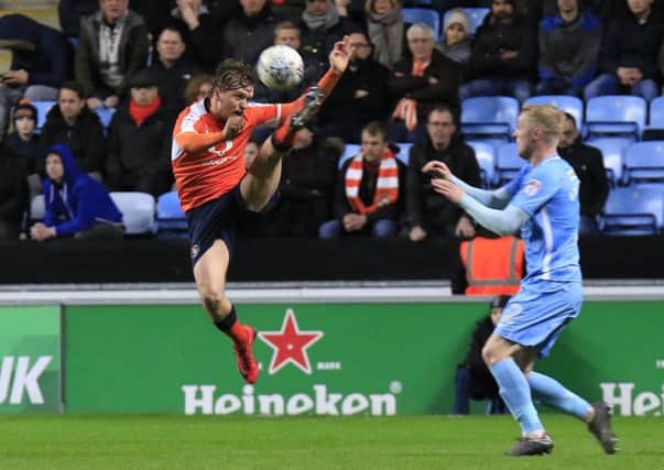 Luke Berry hooks the ball away against Coventry