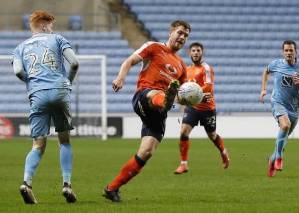Hatters striker James Collins in action at Coventry