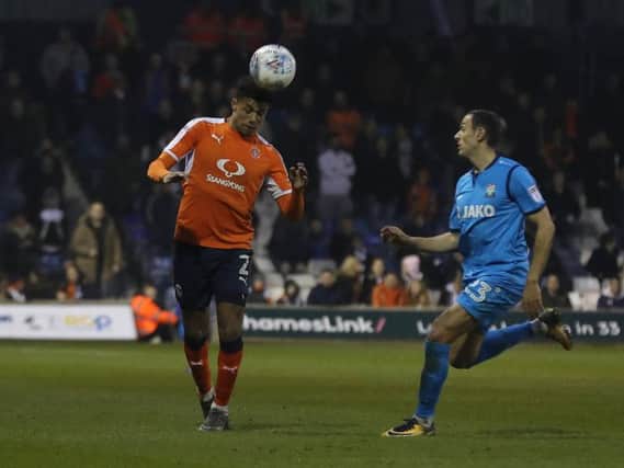 James Justin heads clear against Barnet