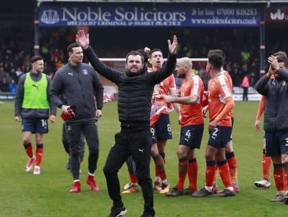 Hatters boss Nathan Jones celebrates the 2-1 win over Mansfield yesterday