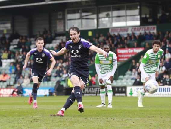 Danny Hylton tucks home his penalty against Yeovil this afternoon