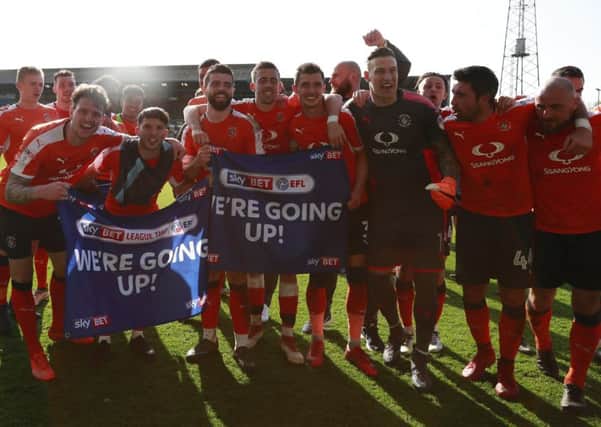 The Hatters celebrate winning promotion on Saturday