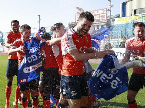 Town's players celebrate promotion on Saturday