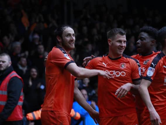 Danny Hylton celebrates putting the Hatters 1-0 in front this afternoon