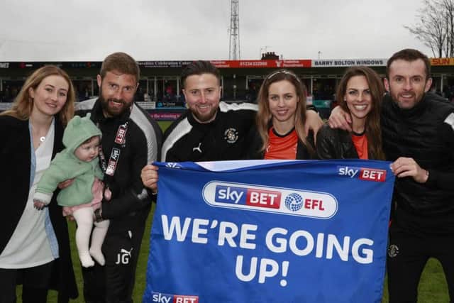 Nathan Jones and his backroom celebrate going up