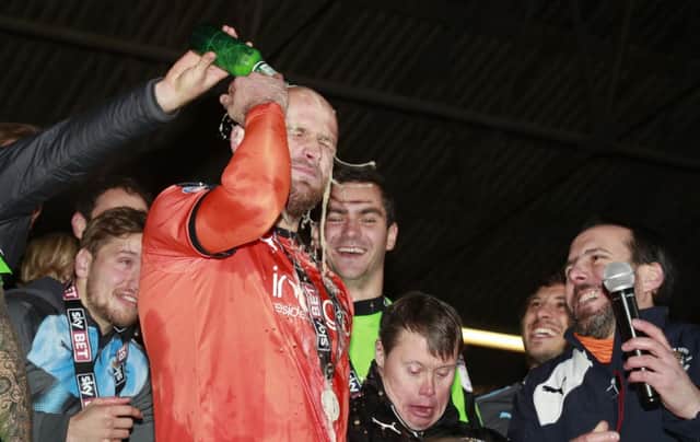 The Hatters celebrate promotion to League One at Kenilworth Road
