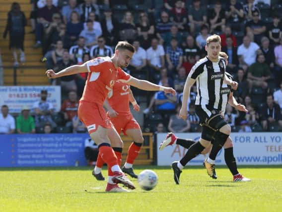 Olly Lee shoots for goal against Notts County