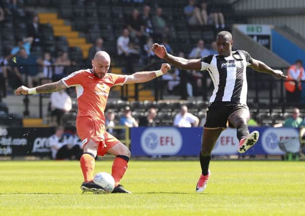 Alan McCormack sends the ball forward against Notts County