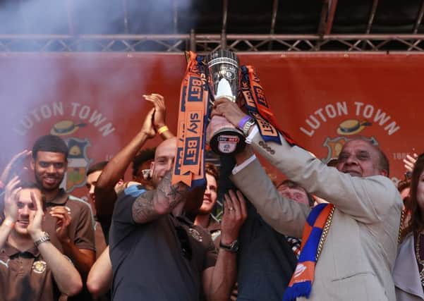 Scott Cuthbert lifts the League Two runners-up trophy