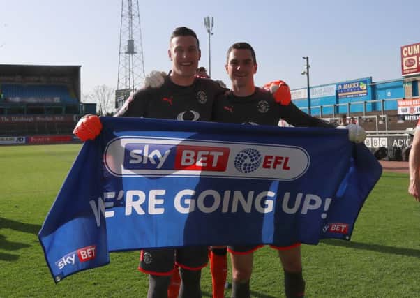 Town's keepers Marek Stech and James Shea celebrate promotion to League One