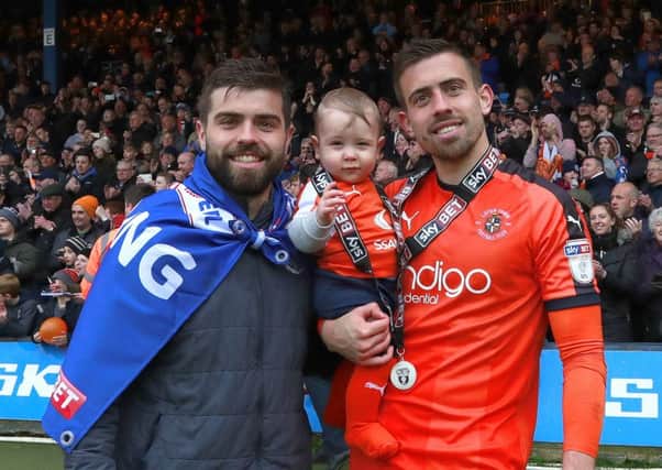Olly Lee celebrates promotion with brother Elliot