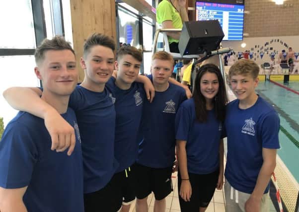 The Dunstable SC swimmers face the camera