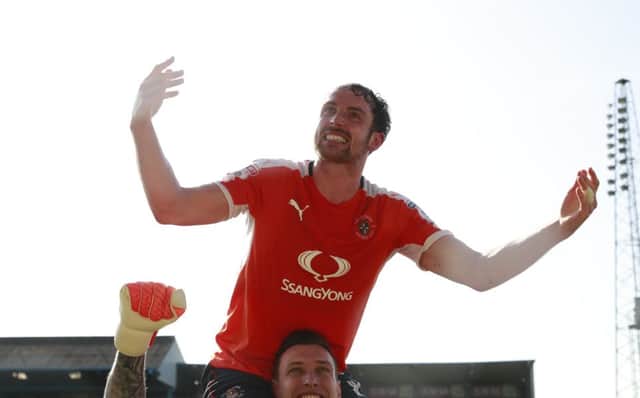 Danny Hylton celebrates winning promotion at Carlisle