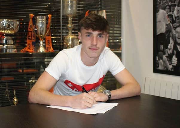 Jack James signs his first pro deal for the Hatters
