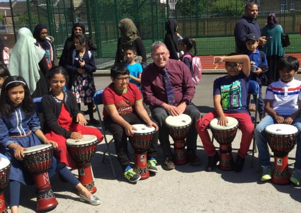 The day included drumming workshops, craft lessons, Gambian geography lessons, and African story times. Here, headteacher Chris Davidson joins in.