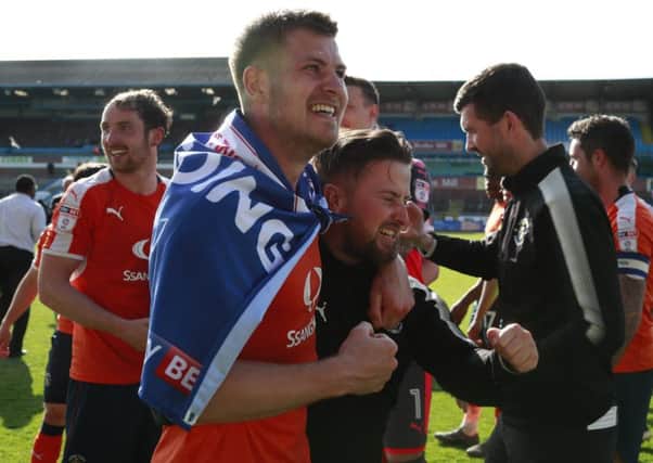 James Collins celebrates promotion at Carlisle