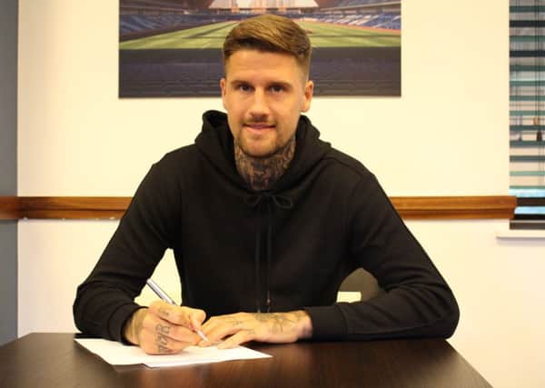 Sonny Bradley signs his Luton contract