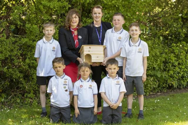 Redrow Give a Hog a Home school donation at Caddington Village School.