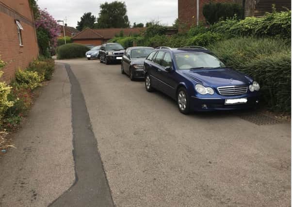 Cars parked in Eaton Green Road