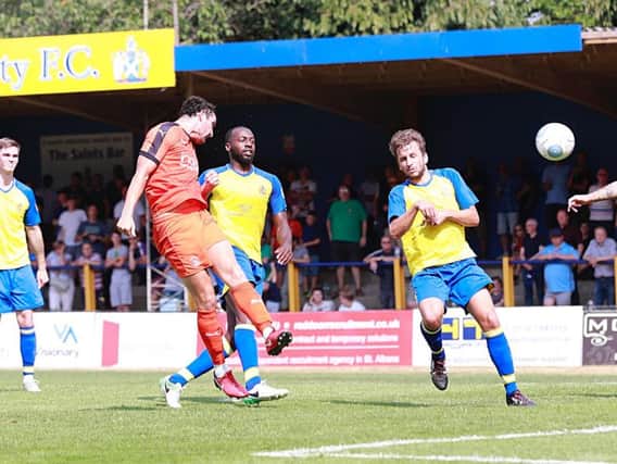 Danny Hylton glances home his second of the afternoon