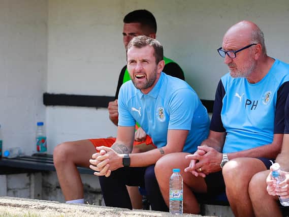 Hatters boss Nathan Jones watches on at St Albans