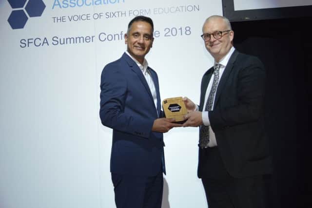 Luton Sixth Form College Principal Designate Altaf Hussain being presented the award