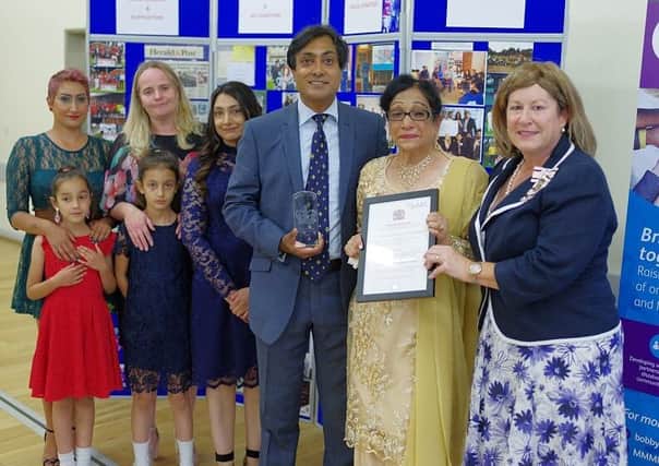 Back row: Bobby's sister Sharon, wife Lynne, and sister Kiran
Front row: His daughters: Elini-Amrit (red dress), and Jasmin (blue dress), Bobby, his mother Shindar and HM Lord-Lieutenant of Bedfordshire Helen Nellis.