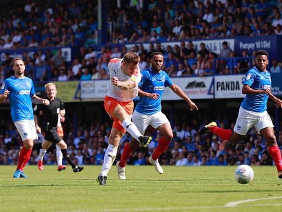 James Collins goes for goal against Portsmouth