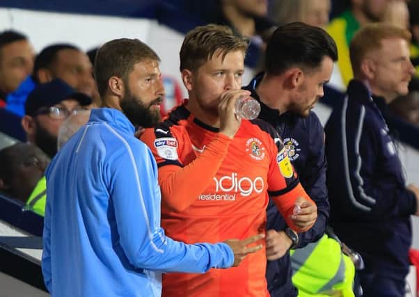 Luke Berry has a drink before heading on at the Hawthorns last night