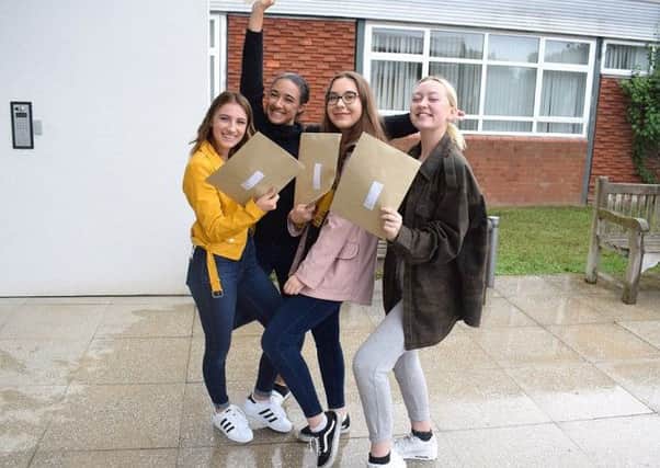 Pupils receive their results at Cardinal Newman School