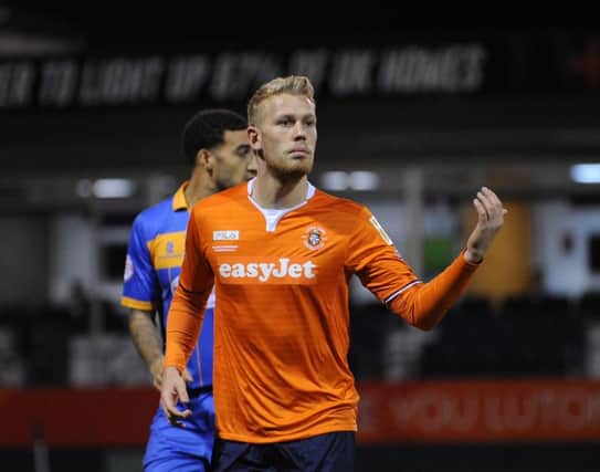 Jayden Stockley beckons Town forward during their last  meeting with Shrewsbury at Kenilworth Road in 2015
