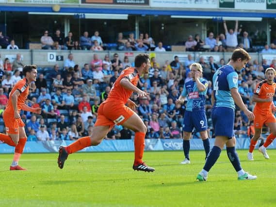 Matty Pearson celebrates after drawing the Hatters level at Wycombe