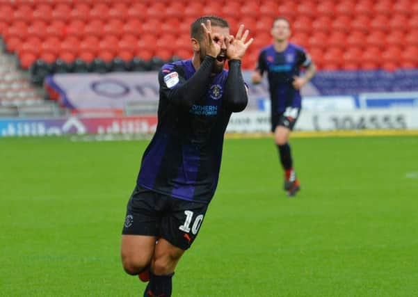 Elliot Lee celebrates his goal against Doncaster on Saturday