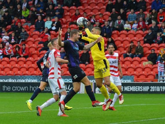 James Collins can't reach this cross at Doncaster on Saturday