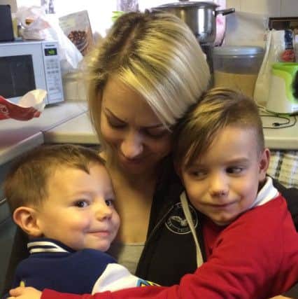 Nicola Woods with her two boys.