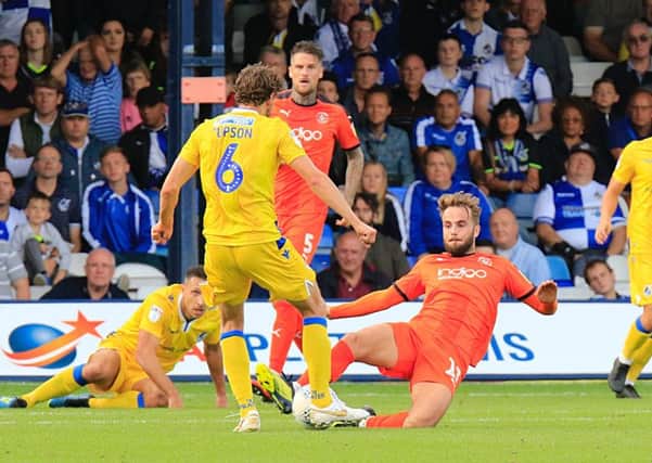 Andrew Shinnie slides in against Bristol Rovers