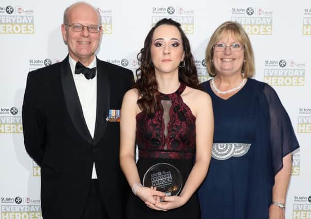 (L-R) Martin Bricknell, Courtney Powdrill and Beth Chesney-Evans attend the St John Ambulance Everyday Heroes Awards, supported by Laerdal Medical. Courtney's award was presented in honour of Guy Evans, who sadly died from a heart arrhythmia at 17 years old when basic first aid skills may have helped save his life. Beth is the mother of Guy and is standing proudly with Courtney. Credit: Tim P. Whitby.