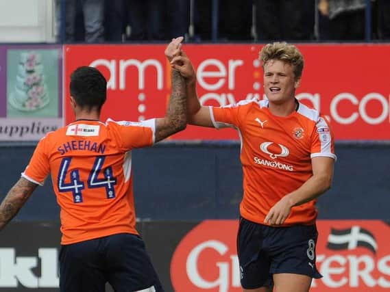 Former Hatter Cameron McGeehan celebrates a goal with Alan Sheehan