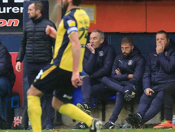 Steve Rutter watches on from the dugout