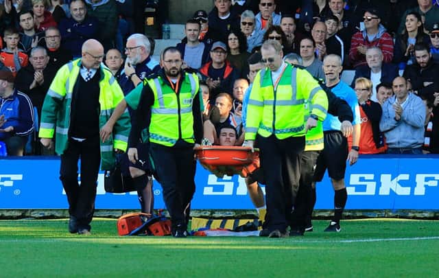 Dan Potts is stretchered off against Walsall