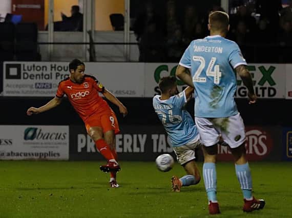 Danny Hylton makes it 3-1 for the Hatters this evening