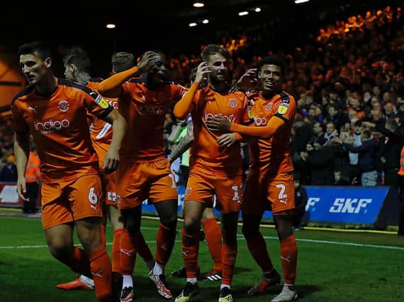 Hatters midfielder Andrew Shinnie celebrates his goal against Accrington on Tuesday night