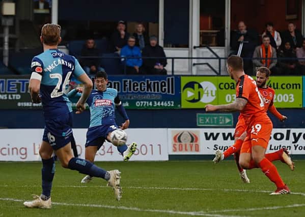 Andrew Shinnie curls home Town's first goal against Wycombe