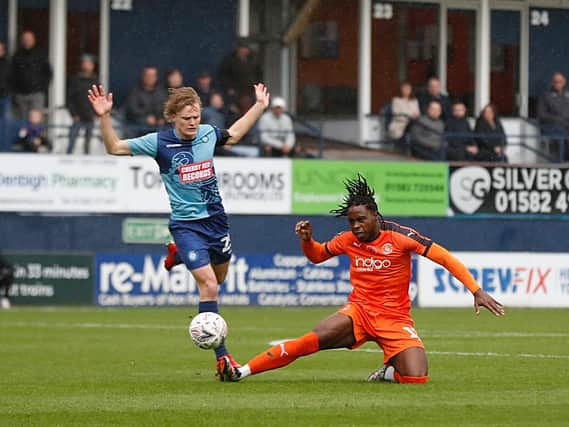Hatters midfielder Pelly-Ruddock Mpanzu gets stuck in as Luton beat Wycombe in the first round